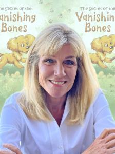 Author Amy Jussel with her new children's book title, Secret of the Vanishing Bones
