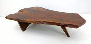 George Nakashima single slab walnut table with one butterfly joint, boasting beautiful grain, 47 inches wide by 28 ½ inches deep. Estimate: $5,000-$8,000.