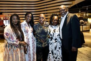 Miami Gardens Mayor Rodney Harris, right, and family meet soul singer Jeffrey Osborne at Embrace Benefit concert.