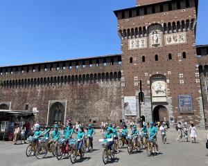 The drug prevention bike tour ended at Castello Sforzesco, a popular destination for tourists and residents, where volunteers handed out Truth About Drugs booklets.