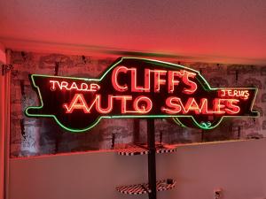 Vintage neon signs will include this gorgeous neon sign for Cliff’s Auto Sales.