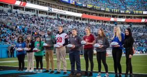 High school community captains during their pre-game award ceremony at Bank Of America Stadium in Charlotte, NC.