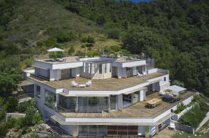 A contemporary California-style villa nestled in a lush green park and overlooking the medieval village of Roquebrune-Cap-Martin will auction in October via Concierge Auctions in cooperation with Damian Tudor of RB International Serenity awaits in Castle Bay, a contemporary California-style villa nestled in a lush green park and overlooking the medieval village of Roquebrune-Cap-Martin.
