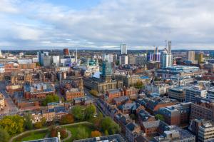 Aerial photo of the Leeds town centre in the UK showing the Leeds Town Hall with construction work being done on the tower