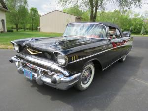 Rare, beautifully restored 1957 Chevrolet Bel Air convertible with a fuel-injected 283 cubic inch engine and automatic transmission, black in color.