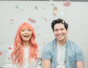 Sprinkles Media founders Jess Park with pink hair and Tyler Eisenhart smiling
