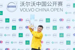 Volvo China Open Champion Holding Trophy Beside Head