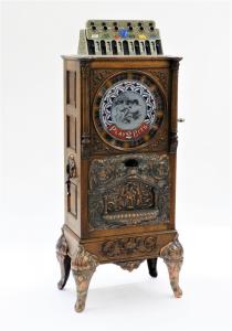 Caille Brothers Eclipse 25-cent slot machine, manufactured in Chicago around 1904, a 63-inch-tall upright floor wheel model ($18,750).
