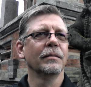 <img src="author oliver phipps.jpg" alt="oliver phipps at exotic location looking at statue">
