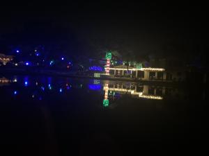 Beautiful Lights Surround a Home on The Winter Park Old Fashioned Christmas Cruise