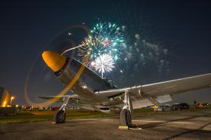 P-51 Mustang, part of the Cavanaugh Flight Museum Collection, during the Addison Kaboom Town fireworks show.