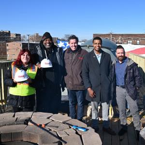 The Reed Construction Team With Project H.O.O.D. Executive Director Pastor Corey B. Brooks at the Tent-A-Thon Rooftop
