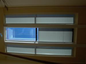 Motorized skylight screens