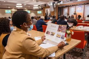 A farmer going over the Tools For Life training brochure.