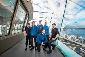 Employees model uniforms on the Observation Deck of the Space Needle