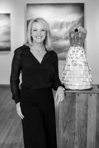 Shelly Hamill, creator of The Keller Prize photographed standing next to one of her mosaic dress sculptures in Aspen Grove Fine Art Gallery Aspen Colorado