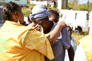 A member of the community crying before receiving counselling