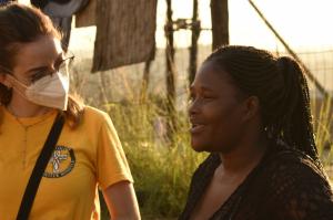 A volunteer Minister, Chloe Cardoso providing counselling to a flood survivor.