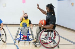 Matt Scott with a young adaptive athlete