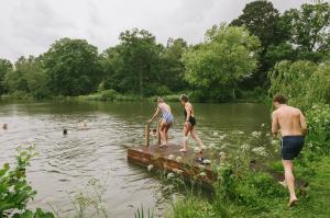 Guests swimming in the Pleasure Grounds lake