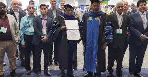 Mr. Suthanthiran accepts Doctorate Degree in Business Administration from Dr. Roger Richardson, President of Rhema University.