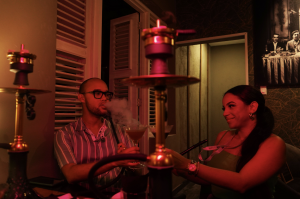 A shot showcasing how 'Magic Love' by AlFakher brings friends together, shot at Harley's Bar & Lounge in the Caribbean island of Curaçao