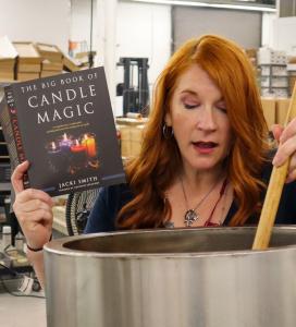 Jacki Smith with her new best seller, "The Big Book of Candle Magic."