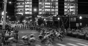 Cyclists turning the corner at a criterium-style race.